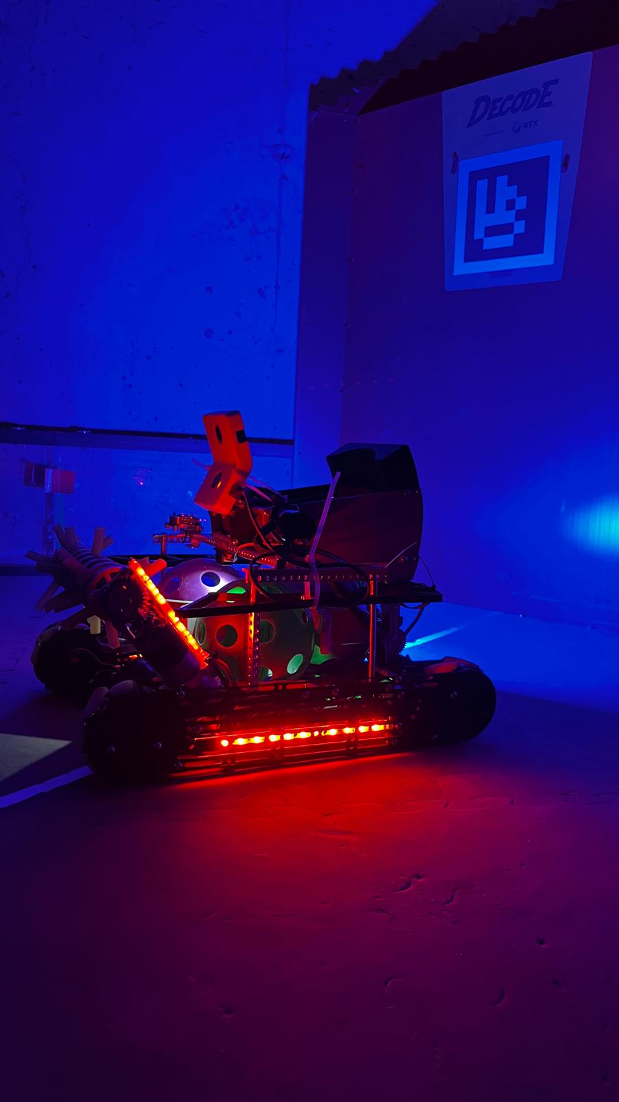 A SingulTech robot lit up on the practice field